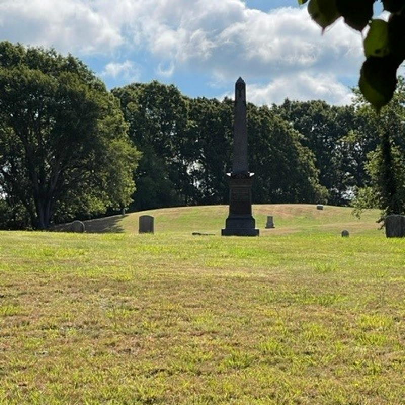 Obelisk monument amid headstones